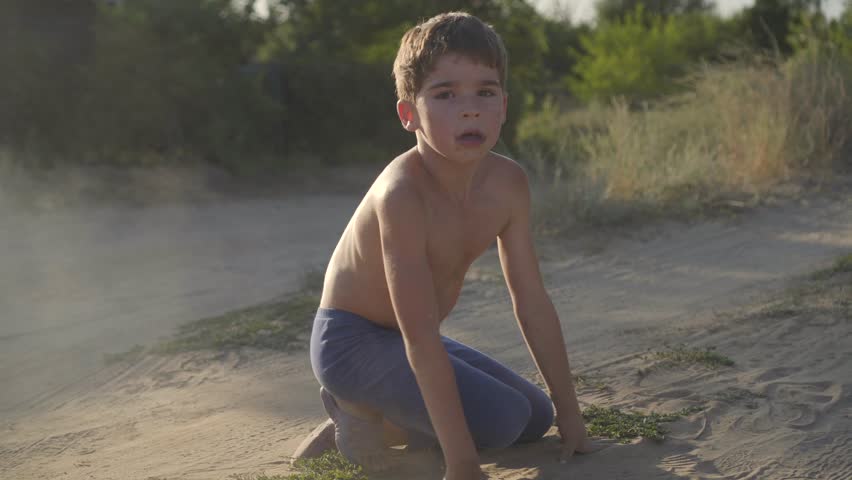 Hy Child Is Lying In The Steppe Dust And Sand Free Play Without Hy Child Is Lying In The Steppe Dust