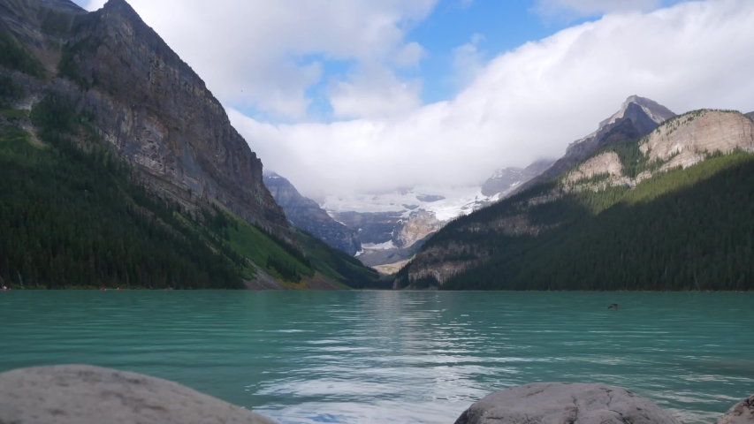 Blue Waters of the reflective lake at Banff National Park, Alberta ...