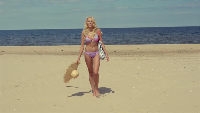 Beautiful Woman Walking On Beach Stock Footage Video 100 Royalty Beautiful Woman Walking On Beach Looking Back At Camera Smiling Steadicam Slow Motion Shot