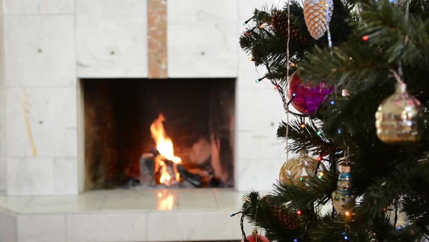 Christmas Tree With Decoration On Background Of Burning Fireplace