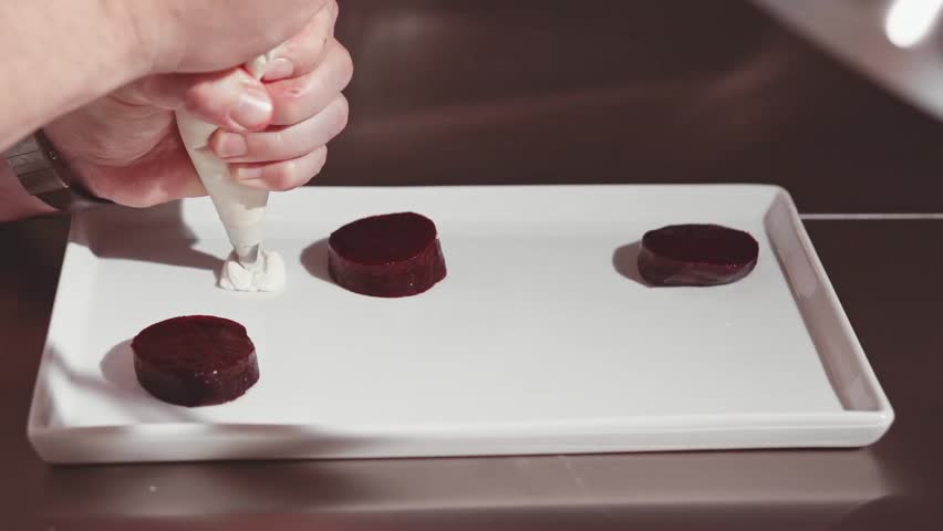 Restaurant Kitchen Video close-up of chef hands cooking and preparing in restaurant kitchen Restaurant Kitchen Video close-up of chef hands cooking and preparing in restaurant kitchen