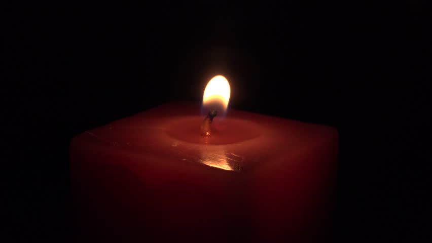 Candle Burning Yellow Flame In Hand, On A Black Background, A Small ...