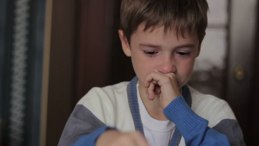 Little Boy Sitting At A Desk Crying, Tears On His Face Stock Footage ...