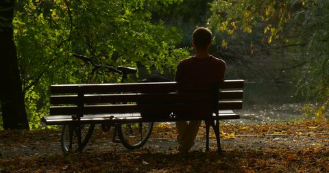 Man is Sitting On the Stock Footage Video (100% Royalty-free) 12095021 |  Shutterstock