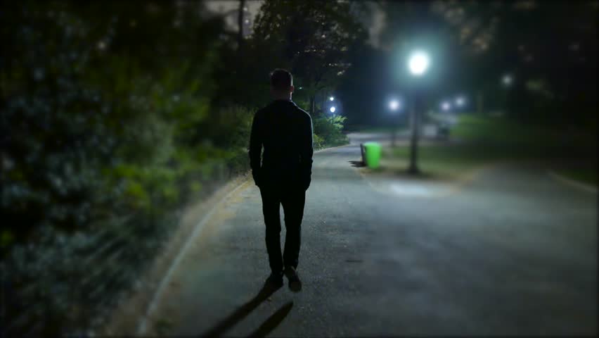 Image result for man walking on street at night