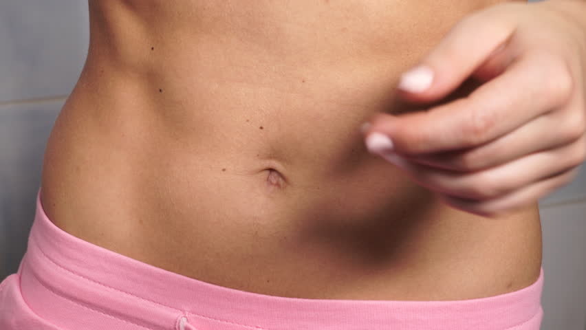 Woman Showing Some Strong Abs And Flat Slim Belly Close Up Part Of