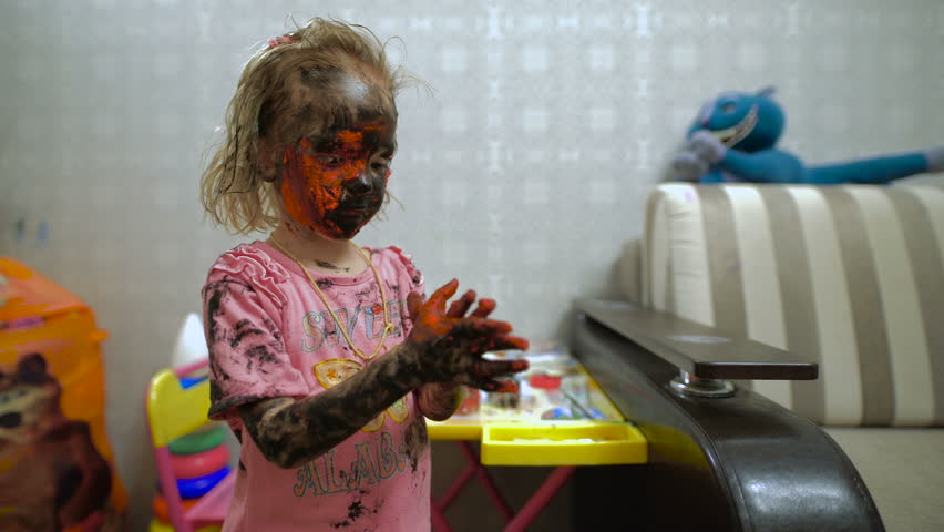 4k00 05a Small Girl With Paint All Over Her Face