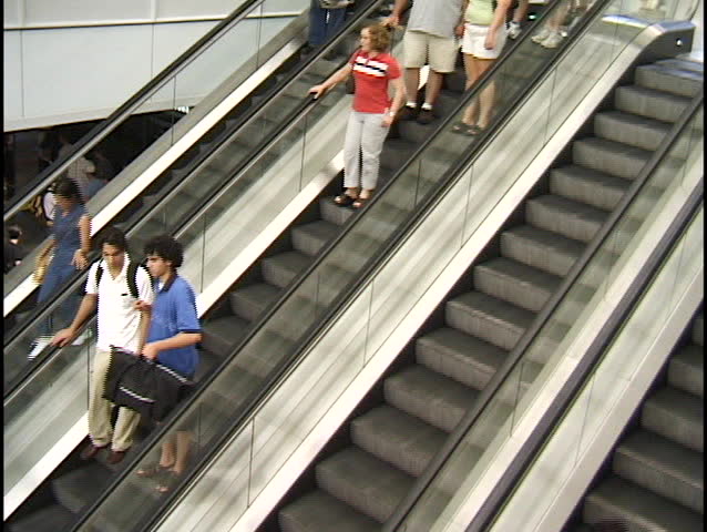 Clown Throwing Pie On Escalator