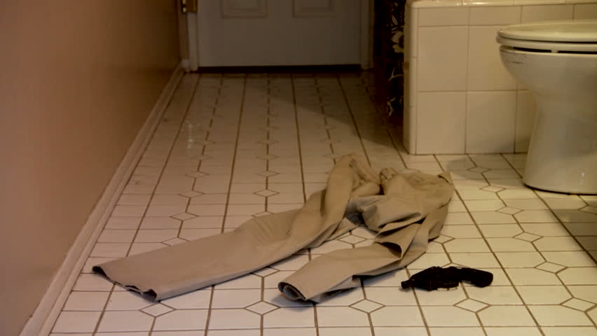 Pants And Gun On Bathroom Floor Static Shot