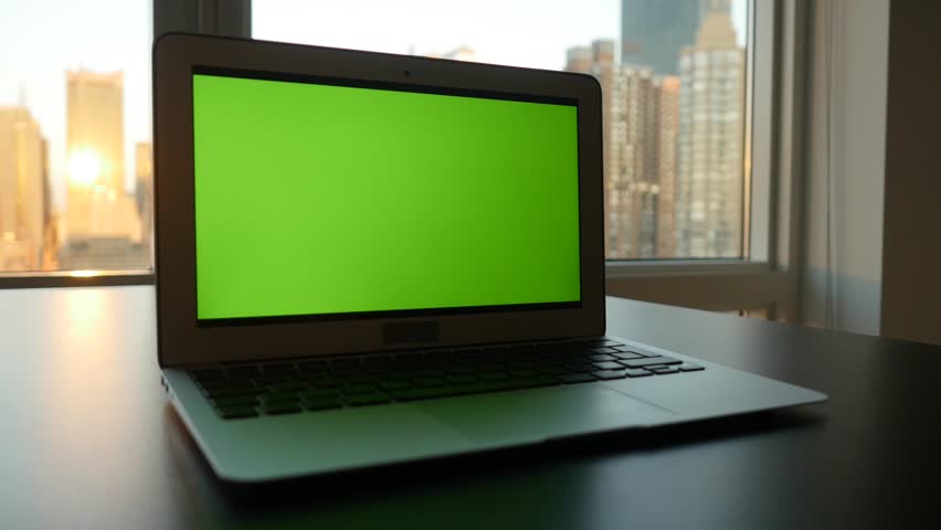 Laptop Computer With Isolated Green Screen Background. Modern City ...