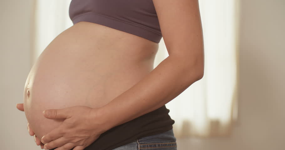 Closeup Of Pregnant Mother Rubbing Her Stomach Stock Footage Video