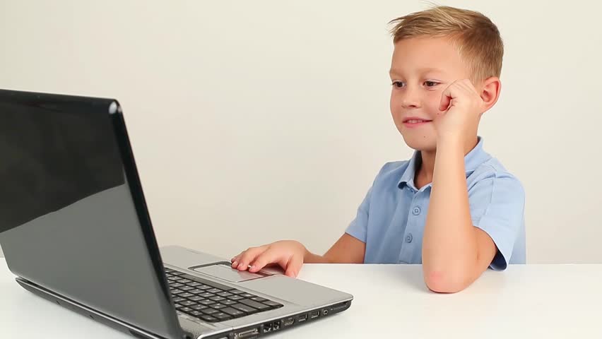 Image result for a boy working on a computer happily
