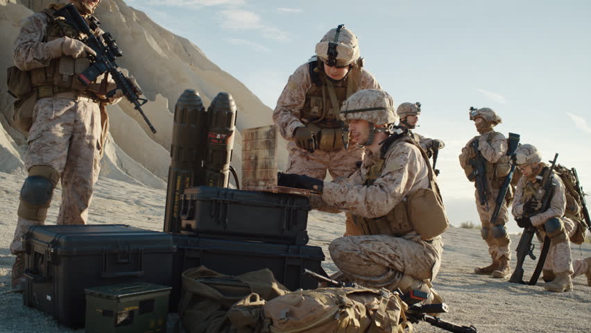 Soldiers Lie Down On The Hill, Aim Through The Assault Rifle Scope In ...