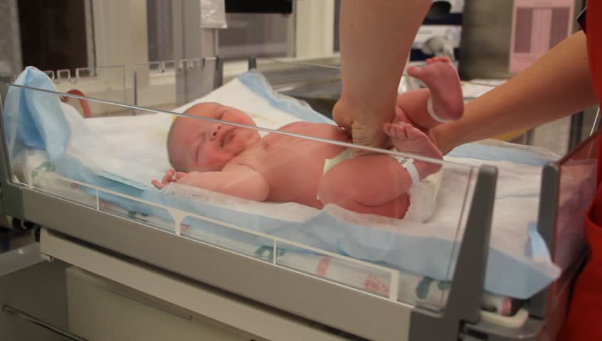 A Newborn Baby At The Hospital Born Just Minutes Before Being Cleaned ...