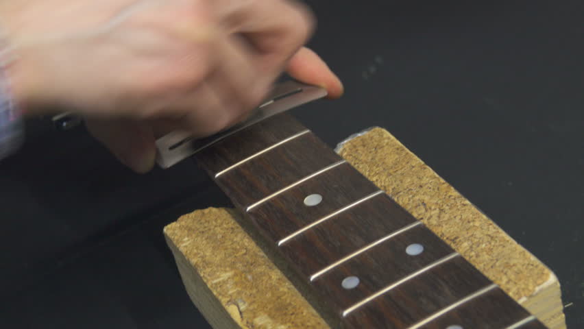 sanding guitar fretboard