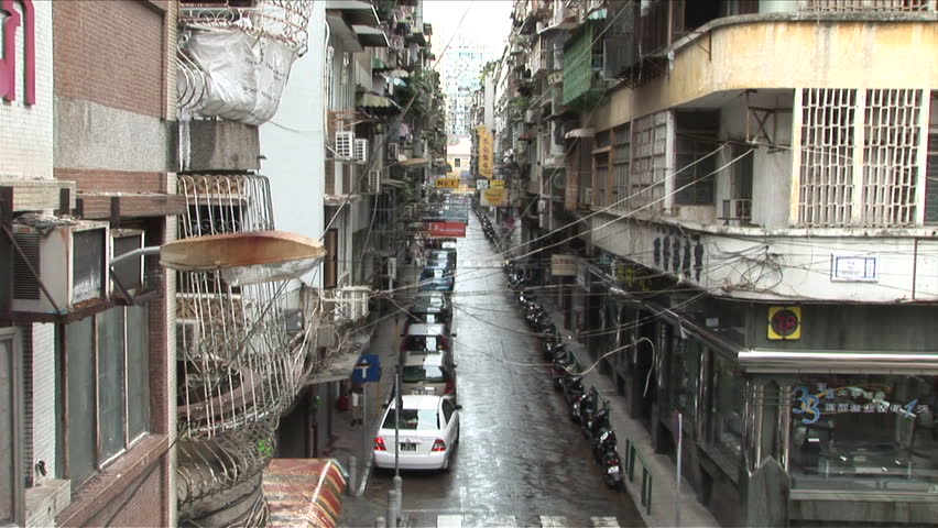 Macau China Circa March Stock Footage Video 100 Royalty Free Macau China Circa March 2007 Very Narrow Street Full Of Apartment Buildings With Almost Ody On The Road
