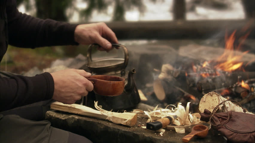 Man Making Coffee Over Camp Fire Stock 