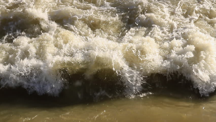 Torrent Of Muddy Water Down A River On Rainy Days, Forming Foam 