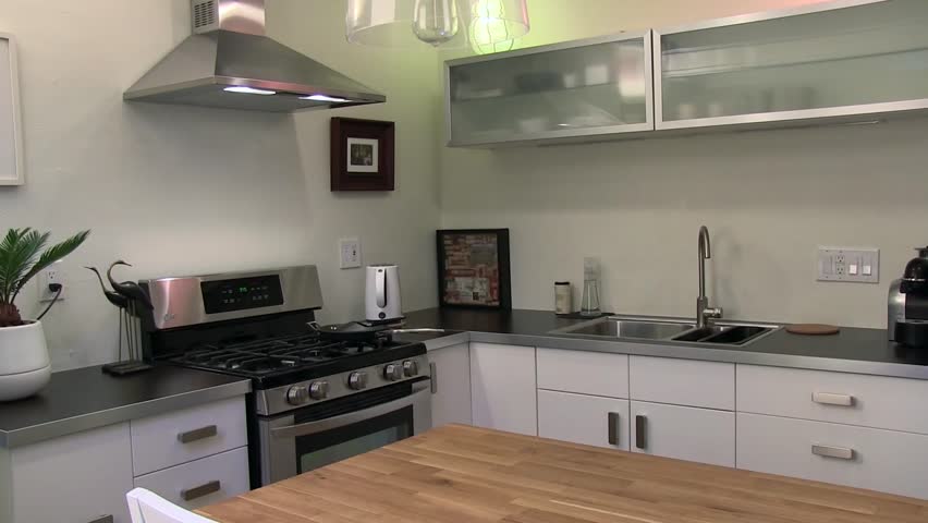 Furniture Design Videos interior of modern kitchen with beige furniture and stove stock Furniture Design Videos interior of modern kitchen with beige furniture and stove stock