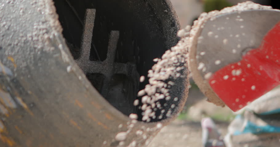 4k00 16macro Shot Of Two Masons Throwing Sand With Shovels Into A