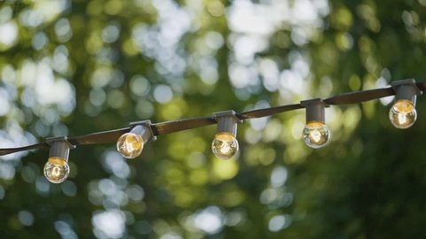 500 String Lights Stock Clips And Footage Royalty Free Garlands Of Lamps On A Stand The Street Light Outdoor Bokeh Bulb Decor
