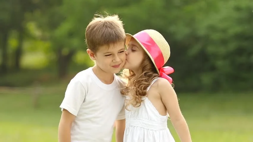 Little Girl Kisses the Boy Stock Footage Video 100