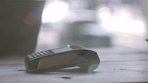 Concept contactless payment. Making payment with credit card and pos terminal, printed check.