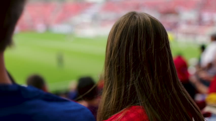 Hd00 44closeup Of 2 Sports Fans Pointing To Professional Soccer
