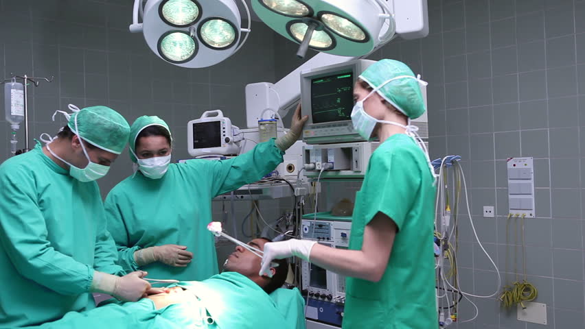 Stock video of group of surgeons working on an | 3067231 