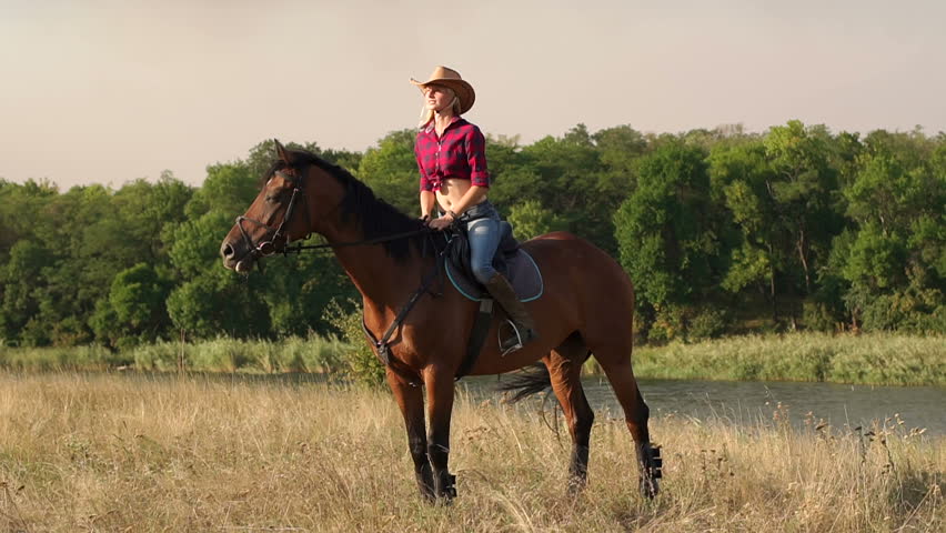 Beautiful Farm Girl Cowgirl Walking On A Farm In Slow Motion Looking