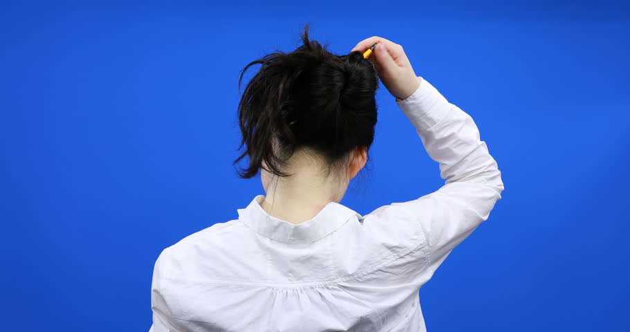 Girl Pulling A Pencil Out Of Her Hair Pencil Bun