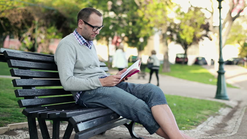 Young Student Using Smartphone And Tablet In The Park Stock Footage ...