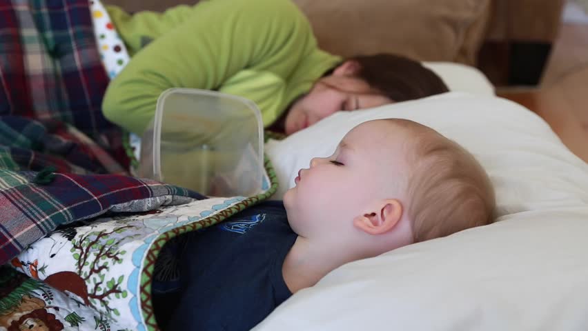 Hd00 15a Little Toddler Boy With The Flu Resting On The Floor Next To