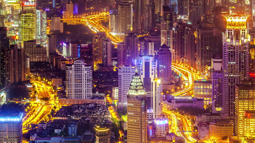 Zoom In Time Lapse: Aerial Night View Of Skyscraper And Illuminated ...