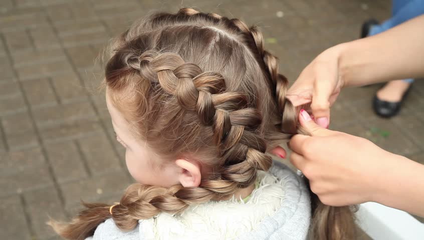 Children S Hairstyle Hairdresser Makes Hairstyle With Braided Hair