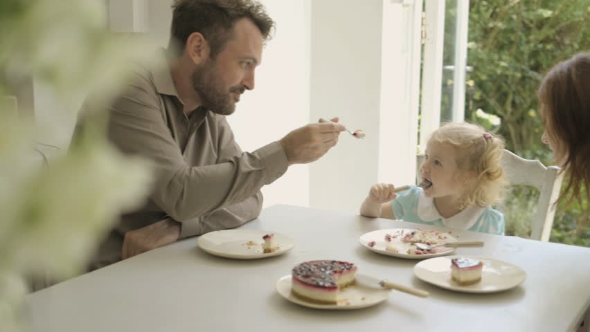 Family Eating Cake And Having Stock Footage Video 100 Royaltyfree