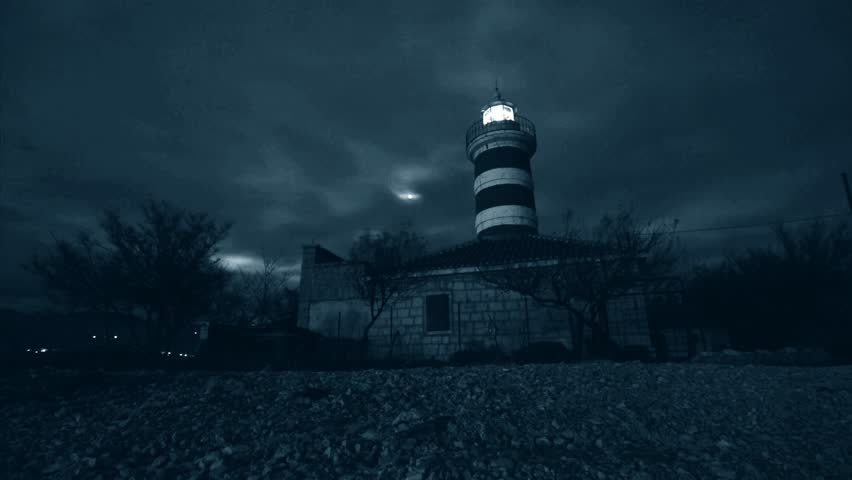 The Lighthouse Is Projecting Light Signals In Stormy Winter Night ...