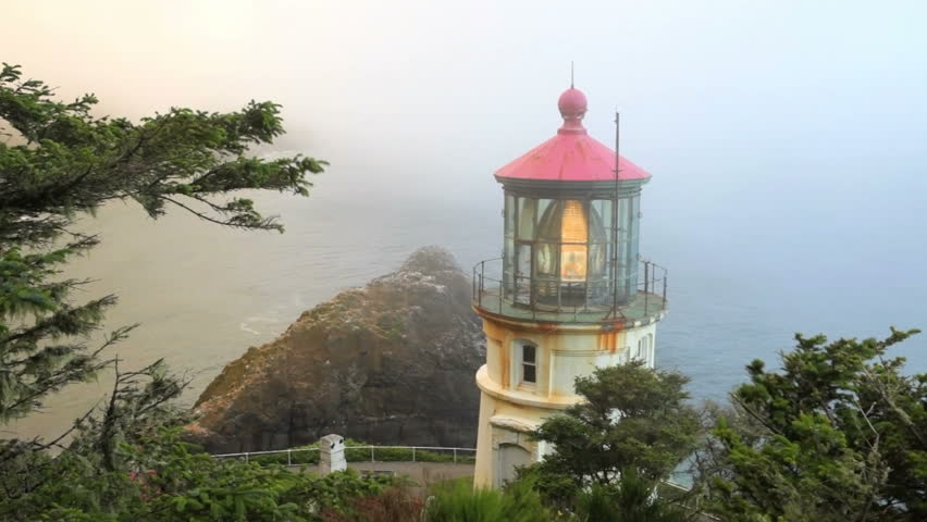 Along The Oregon Coast Stands The Heceta Head Lighthouse, Lit Up At ...