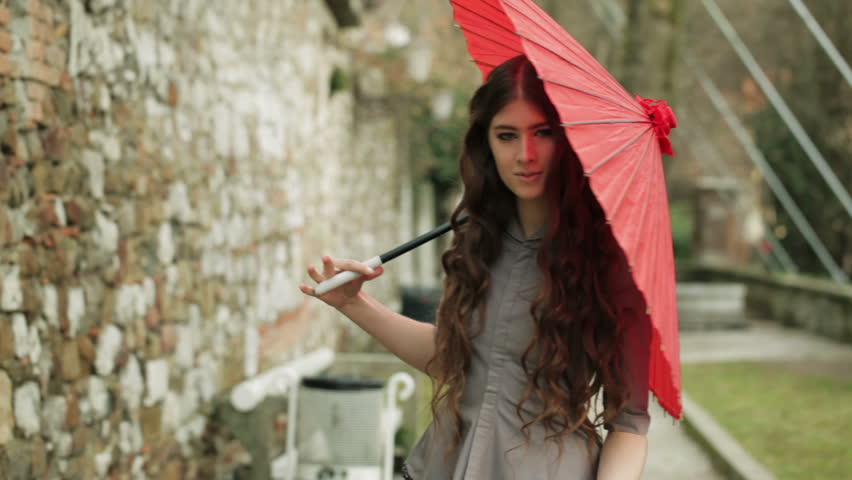 Fashion Model With Extremely Long Curly Hair Poses With Beautiful