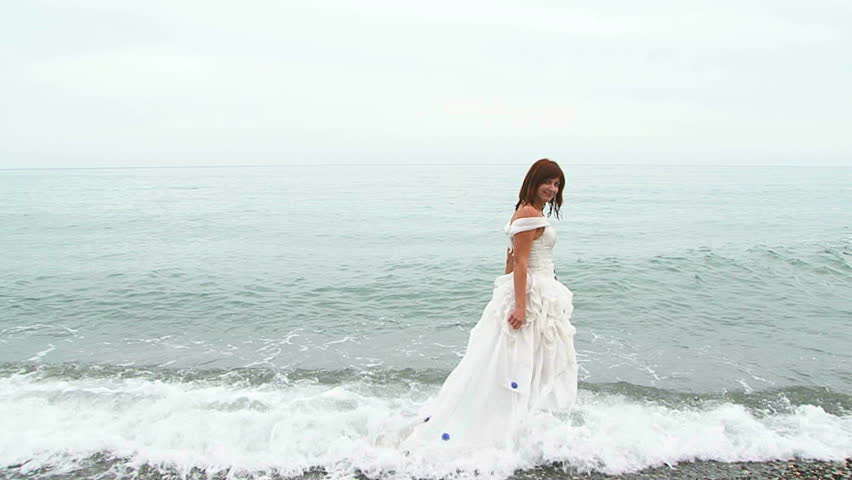 Girl in a white dress walking on the beach images Girl in a white dress walking on the beach images