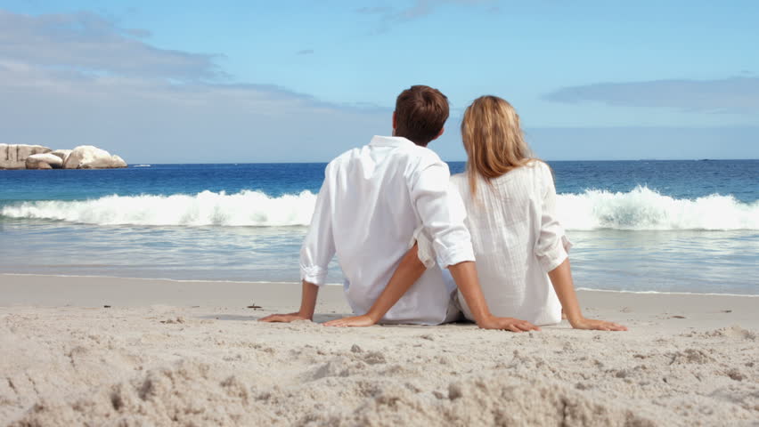 Happy Couple In Love Sitting On The Beach Stock Footage Video 10892981 Shutterstock